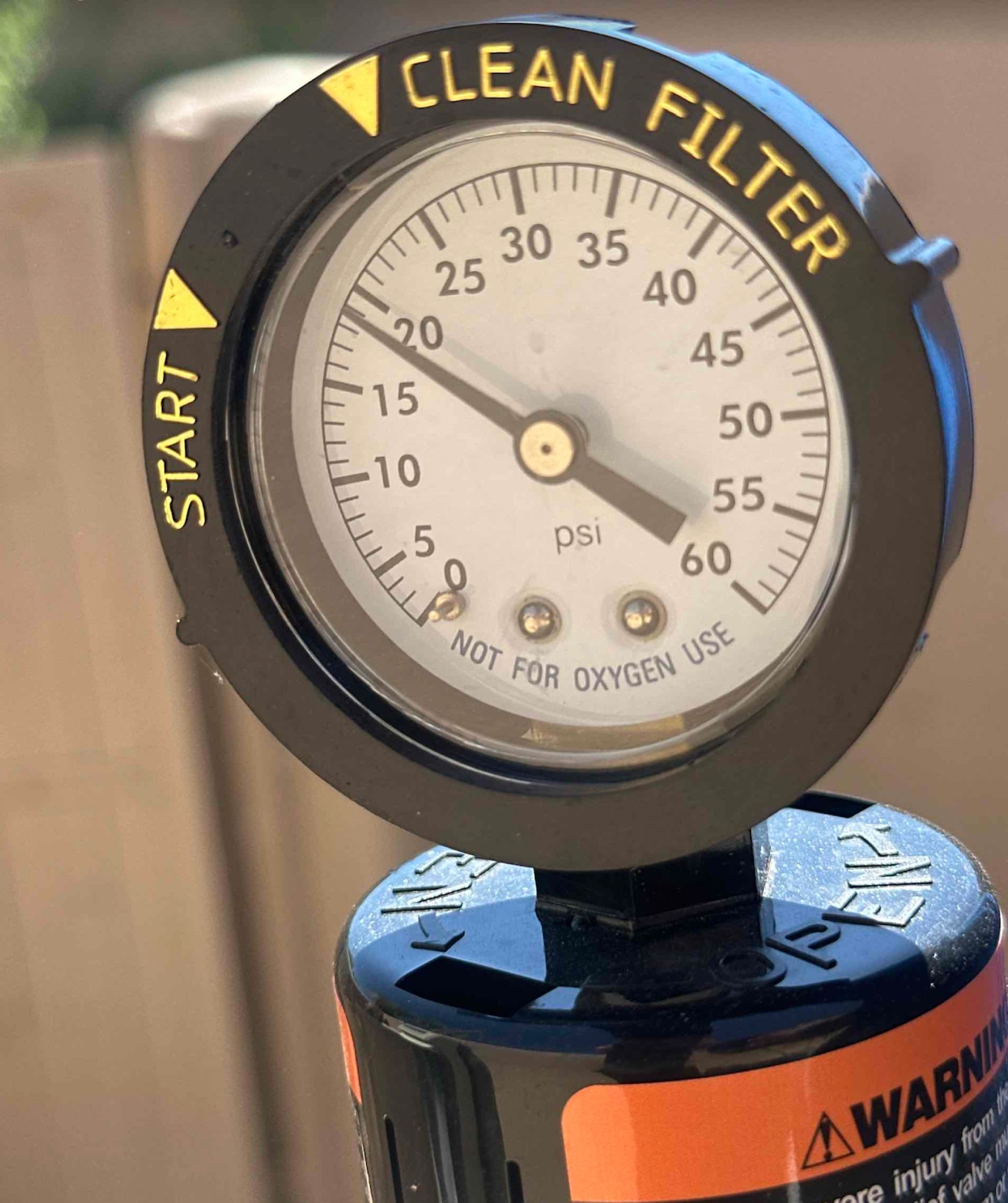 Close-up of a pool filter pressure gauge